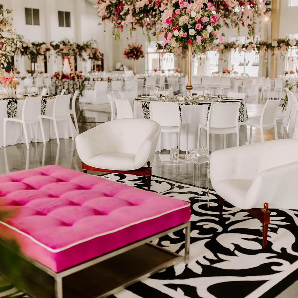 black, white, and pink sitting area in wedding reception