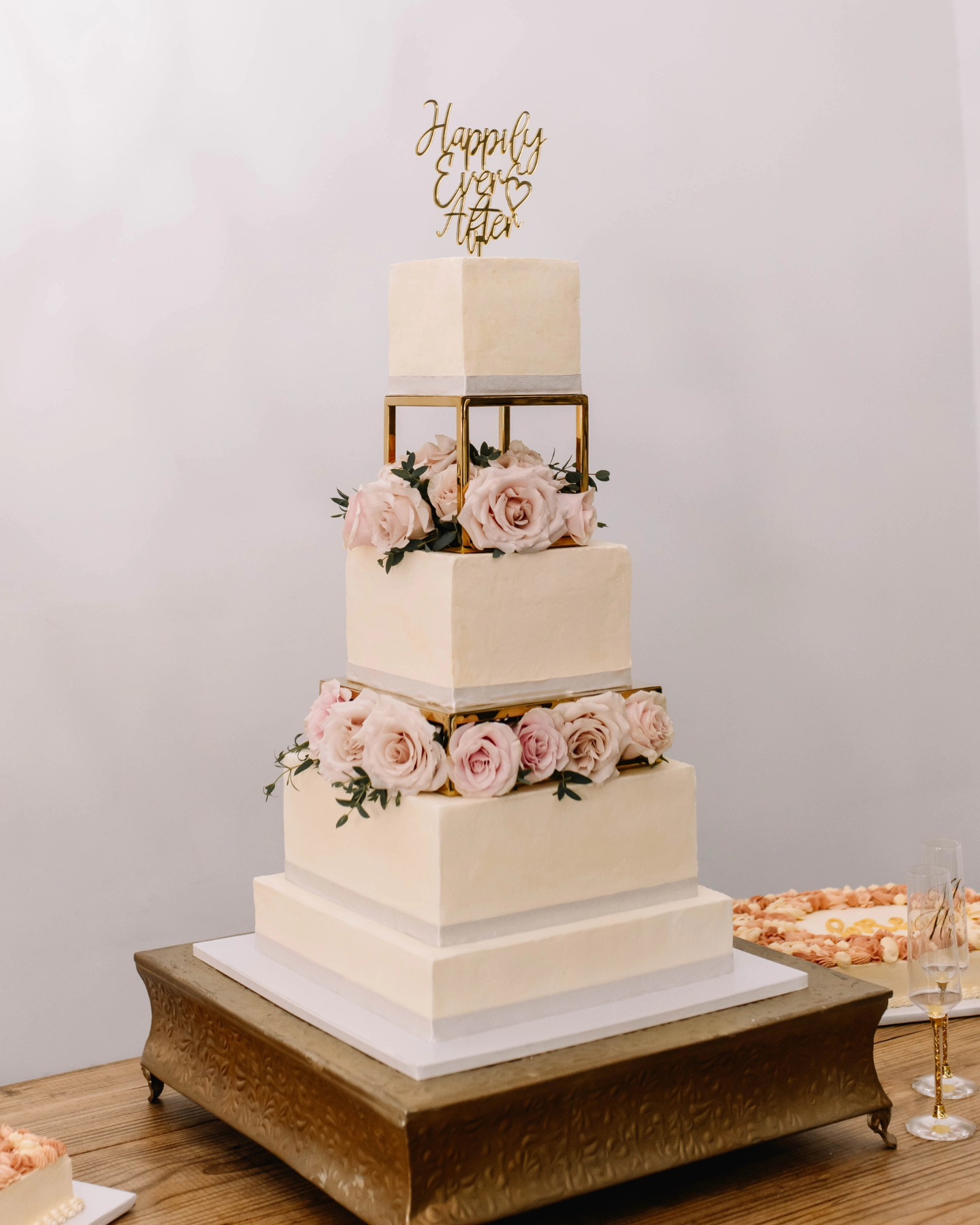 square wedding cake with pink roses