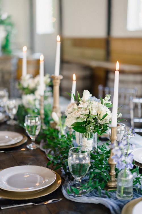 blue and white floral table runner with candle sticks