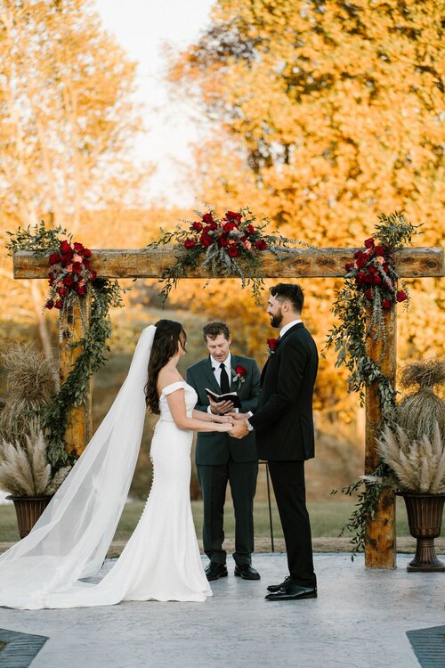 bride and groom saying vows in outdoor wedding
