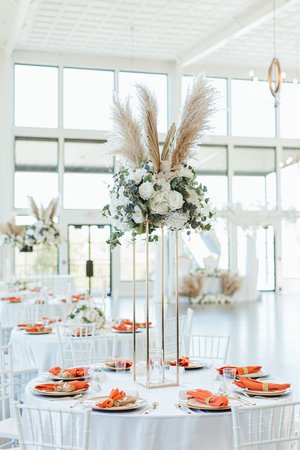 tall wedding reception floral centerpiece with pampas grass