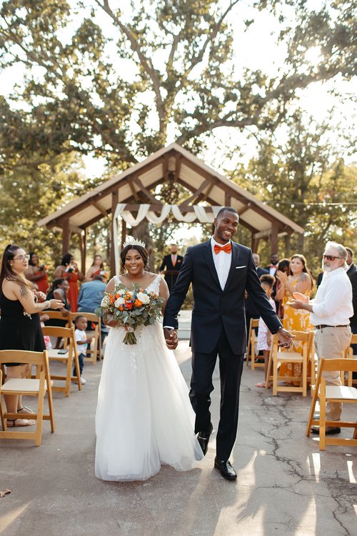 bride and groom walking down the aisle